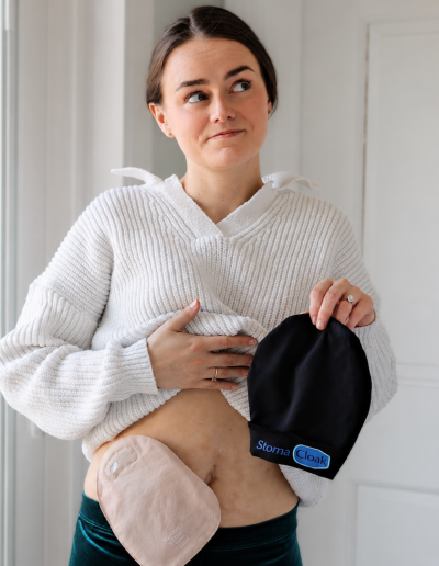Let's Talk IBD's Maggie holding a StomaCloak Ostomy Pouch Cover